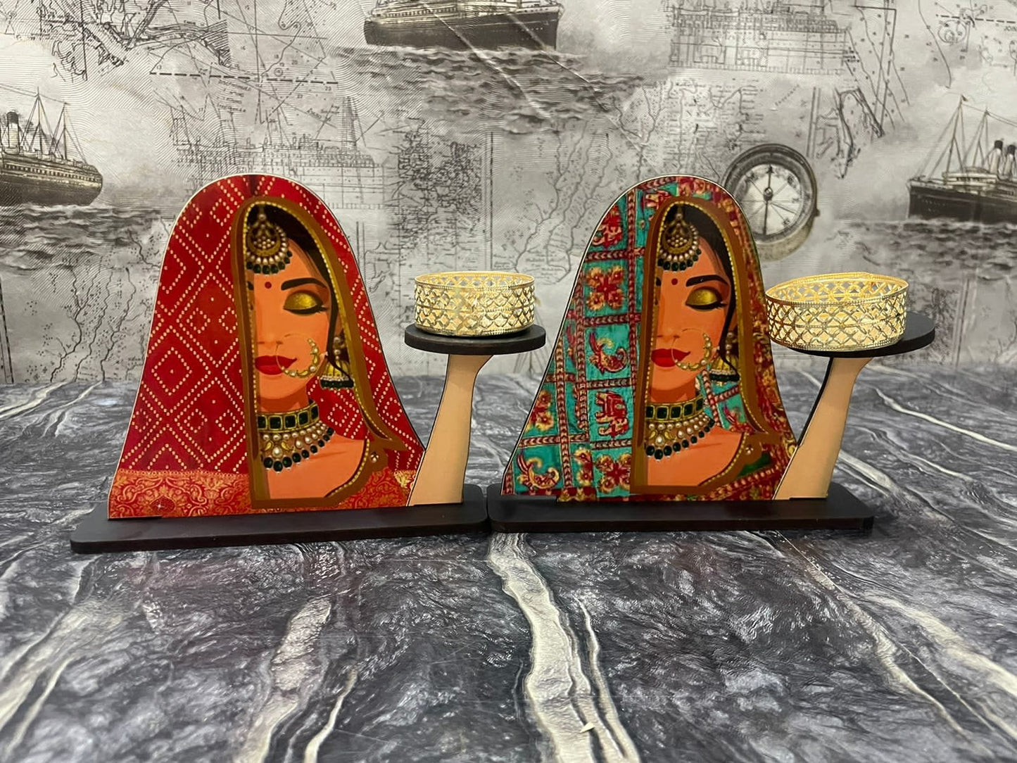 Bride with jewelry and a red veil, likely part of a festive or wedding-themed tabletop arrangement.