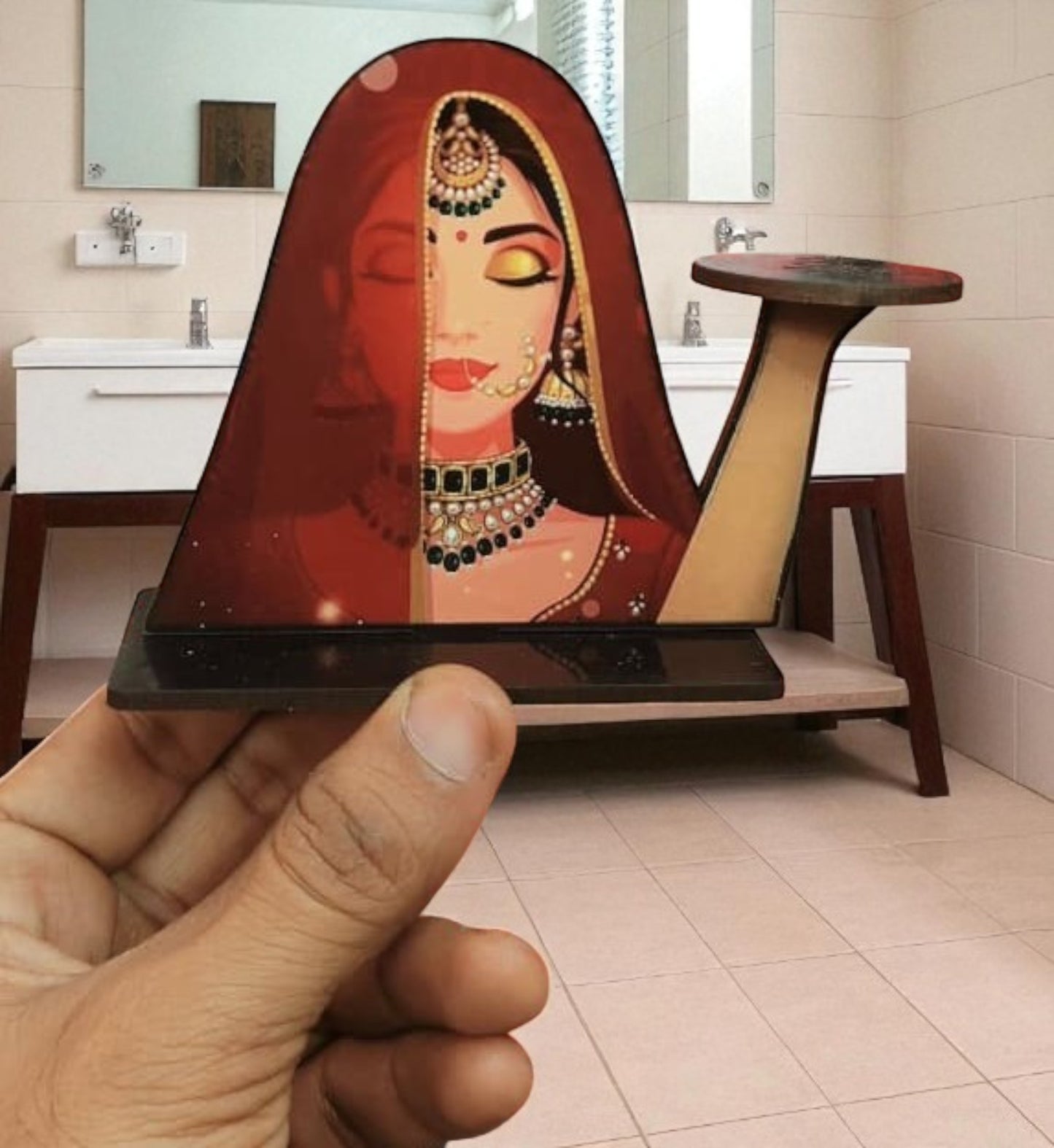 Bride with jewelry and a red veil, likely part of a festive or wedding-themed tabletop arrangement.